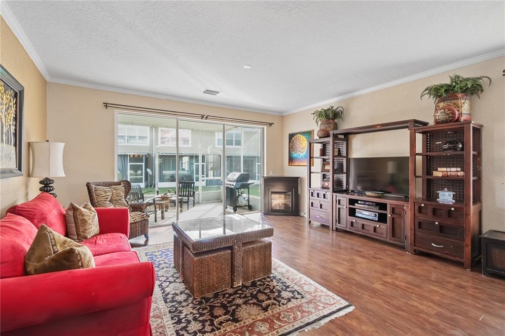 4122 Southwest 54th Circle Ocala, FL 34474 - Photo 6 of 47 a living room with furniture and a flat screen tv
