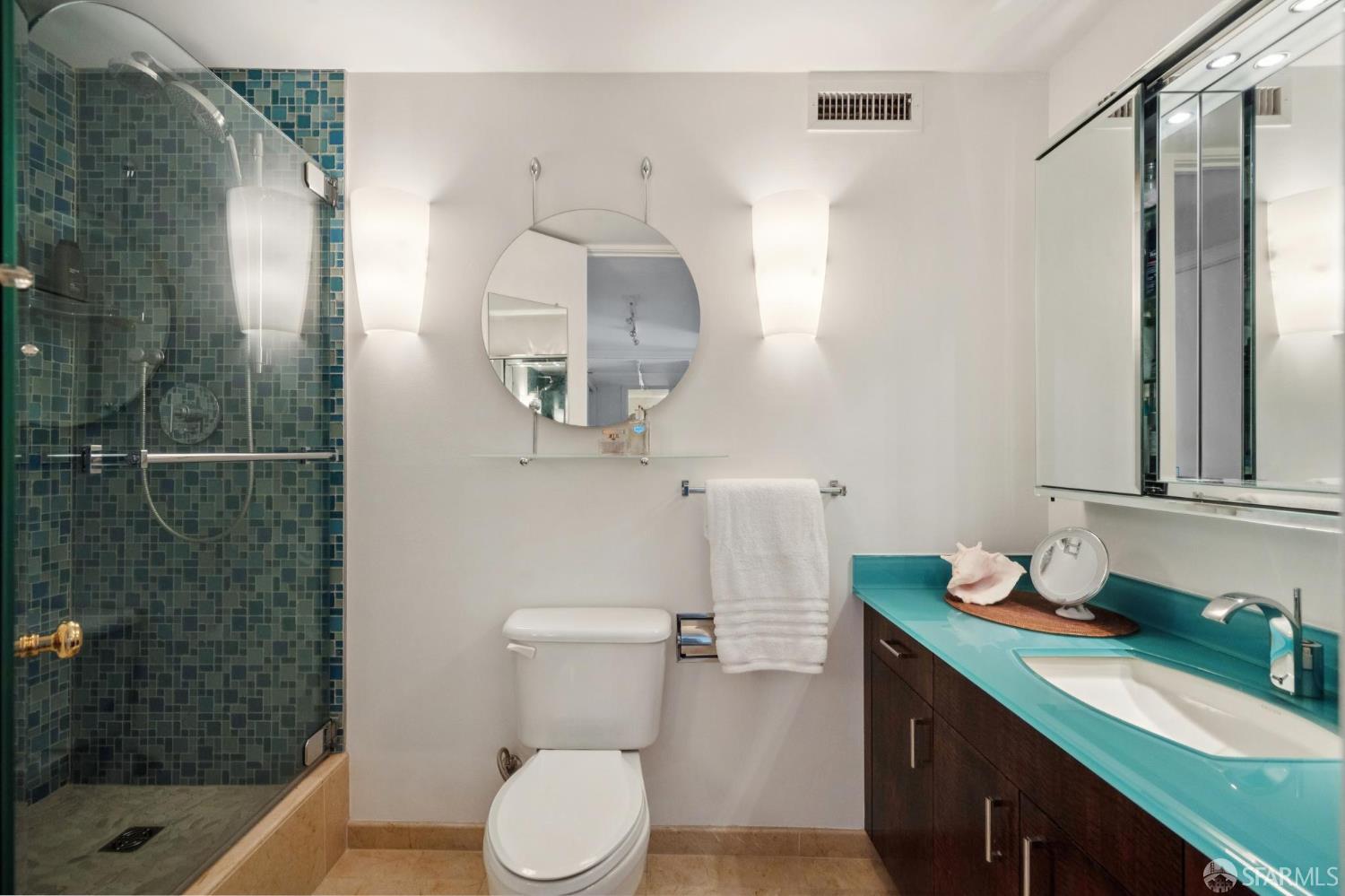 2200 Pacific Avenue, Unit 8E San Francisco, CA 94115 - Photo 18 of 36 a bathroom with a sink a toilet and shower