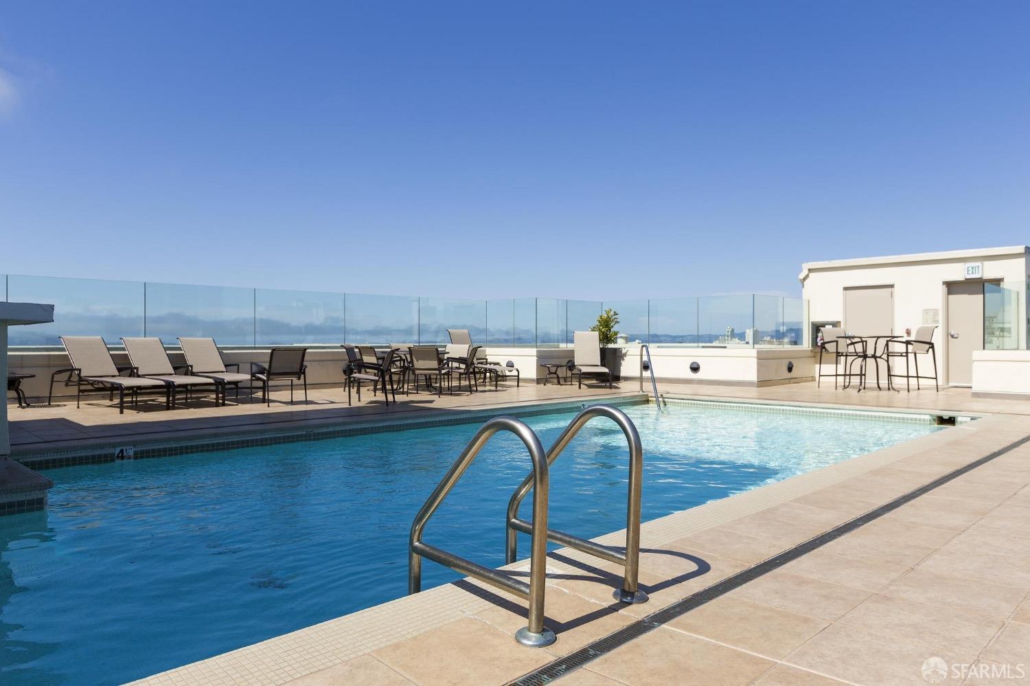 2200 Pacific Avenue, Unit 8E San Francisco, CA 94115 - Photo 22 of 36 a view of a swimming pool and lounge chair