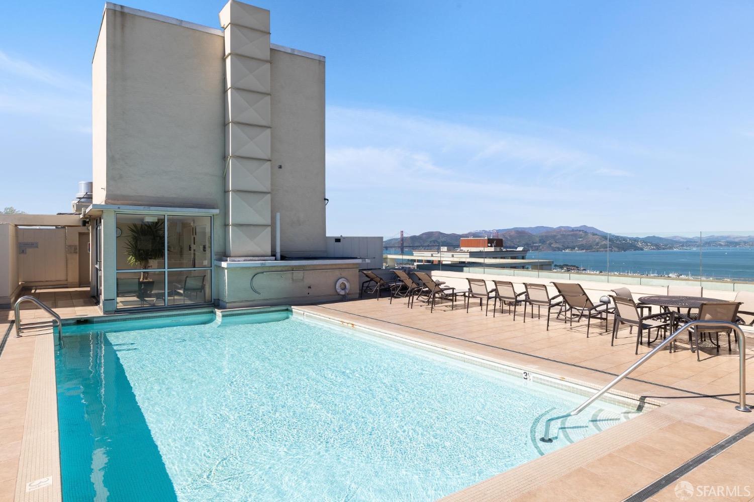 2200 Pacific Avenue, Unit 8E San Francisco, CA 94115 - Photo 23 of 36 a swimming pool with outdoor seating and yard