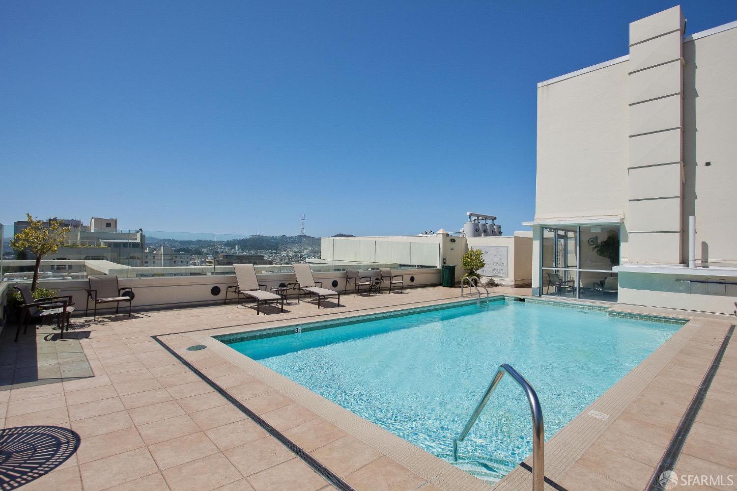 2200 Pacific Avenue, Unit 8E San Francisco, CA 94115 - Photo 24 of 36 a swimming pool with outdoor seating and yard
