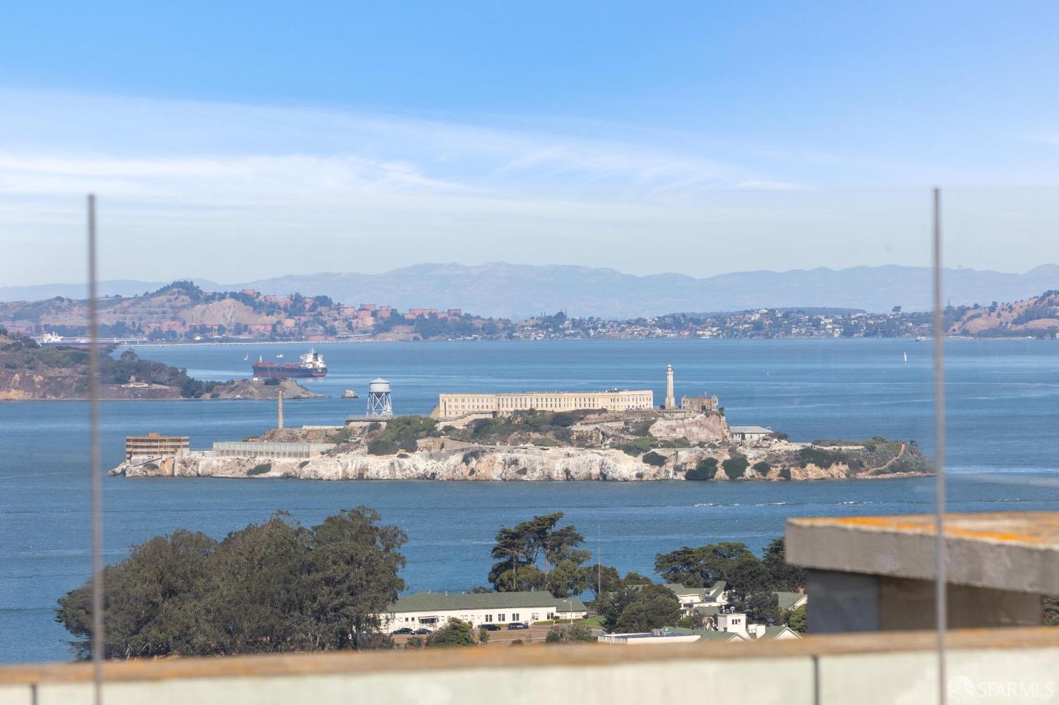 2200 Pacific Avenue, Unit 8E San Francisco, CA 94115 - Photo 26 of 36 a view of a lake with houses in the back
