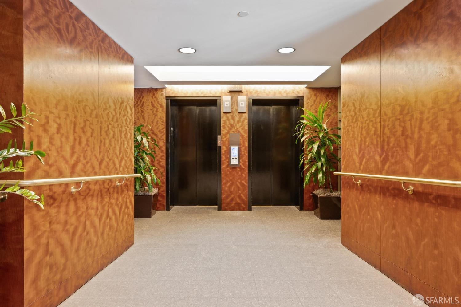 2200 Pacific Avenue, Unit 8E San Francisco, CA 94115 - Photo 33 of 36 a view of a hallway with wooden floor