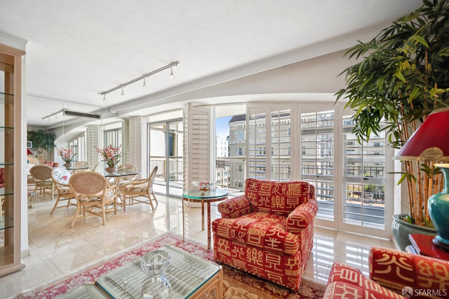 2200 Pacific Avenue, Unit 8E San Francisco, CA 94115 - Photo 4 of 36 a living room with furniture and a floor to ceiling window