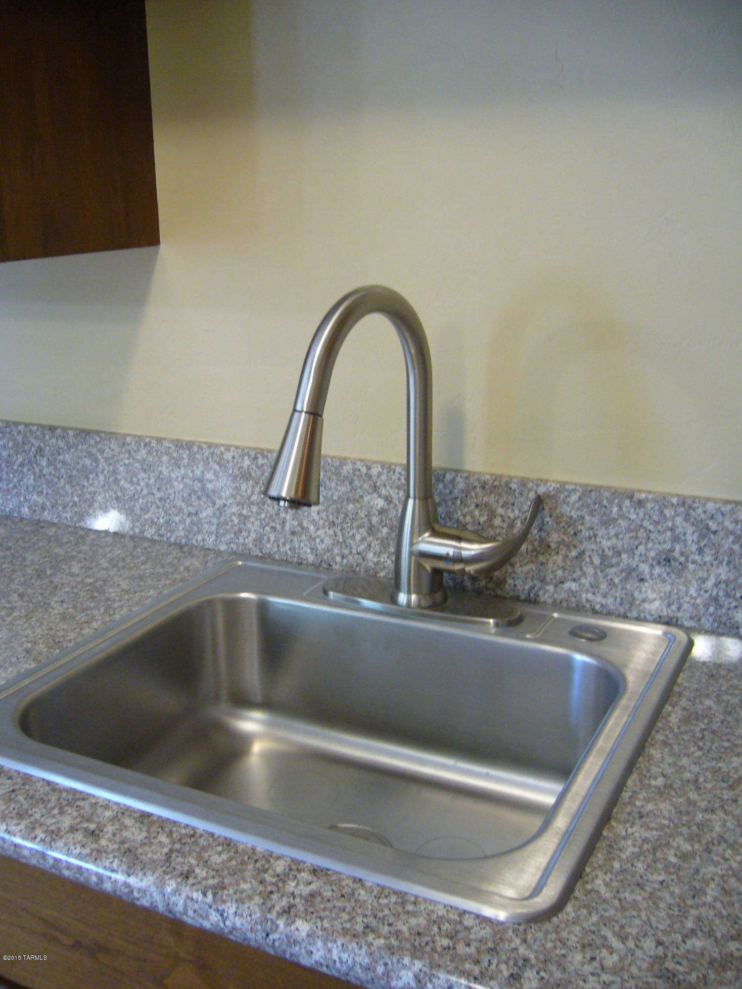 1243 West Kleindale Road Tucson, AZ 85705 - Photo 14 of 46 a close view of sink and tap
