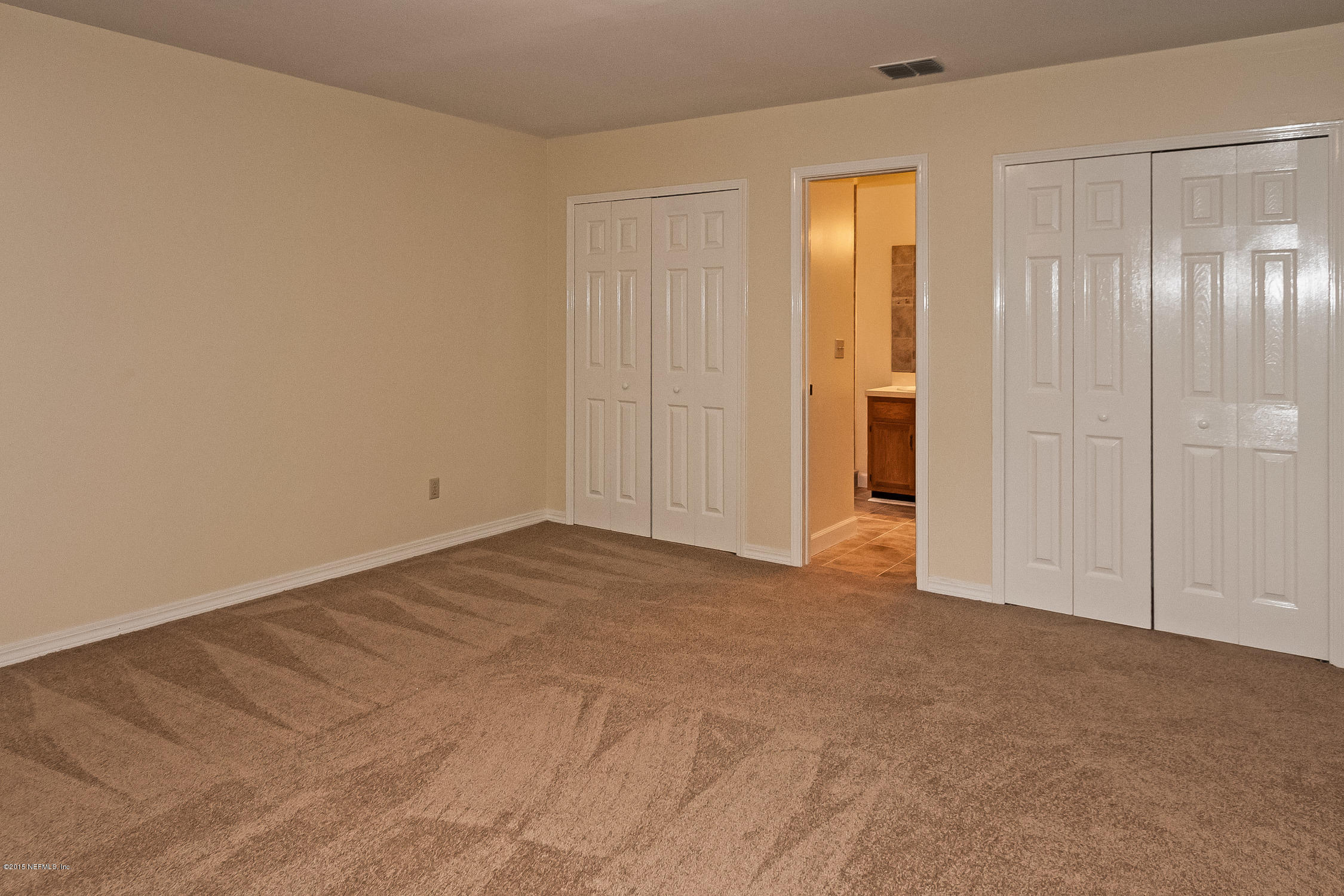 1551 Derringer Road Jacksonville, FL 32225 - Photo 16 of 27 a view of an empty room and closet area