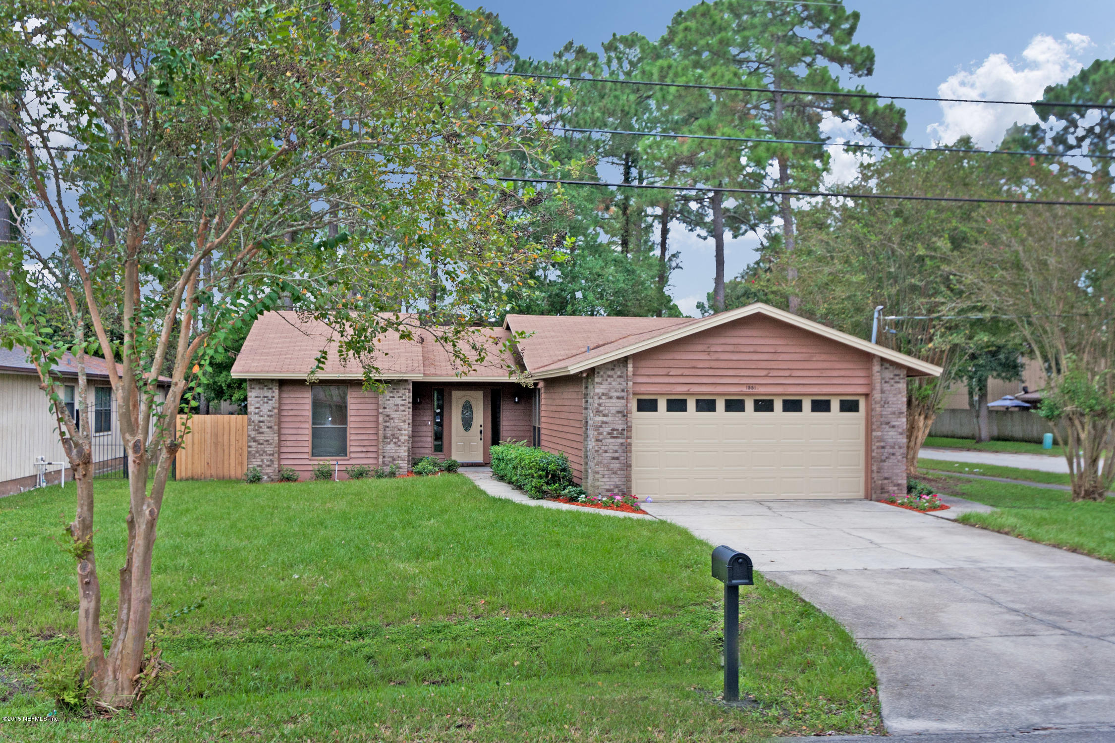 1551 Derringer Road Jacksonville, FL 32225 - Photo 2 of 27 a view of a house with a yard and large tree