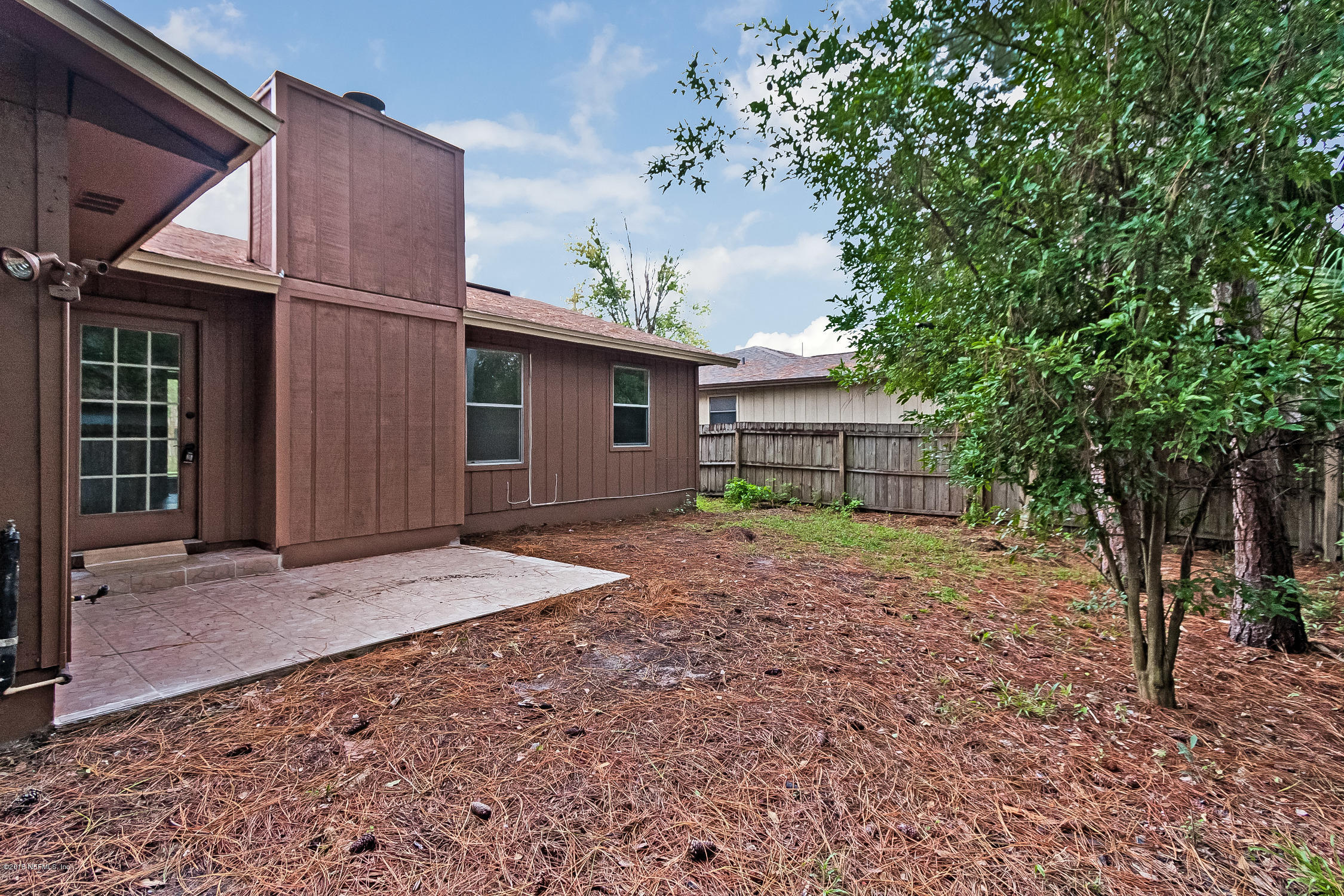 1551 Derringer Road Jacksonville, FL 32225 - Photo 23 of 27 a house with trees in front of it