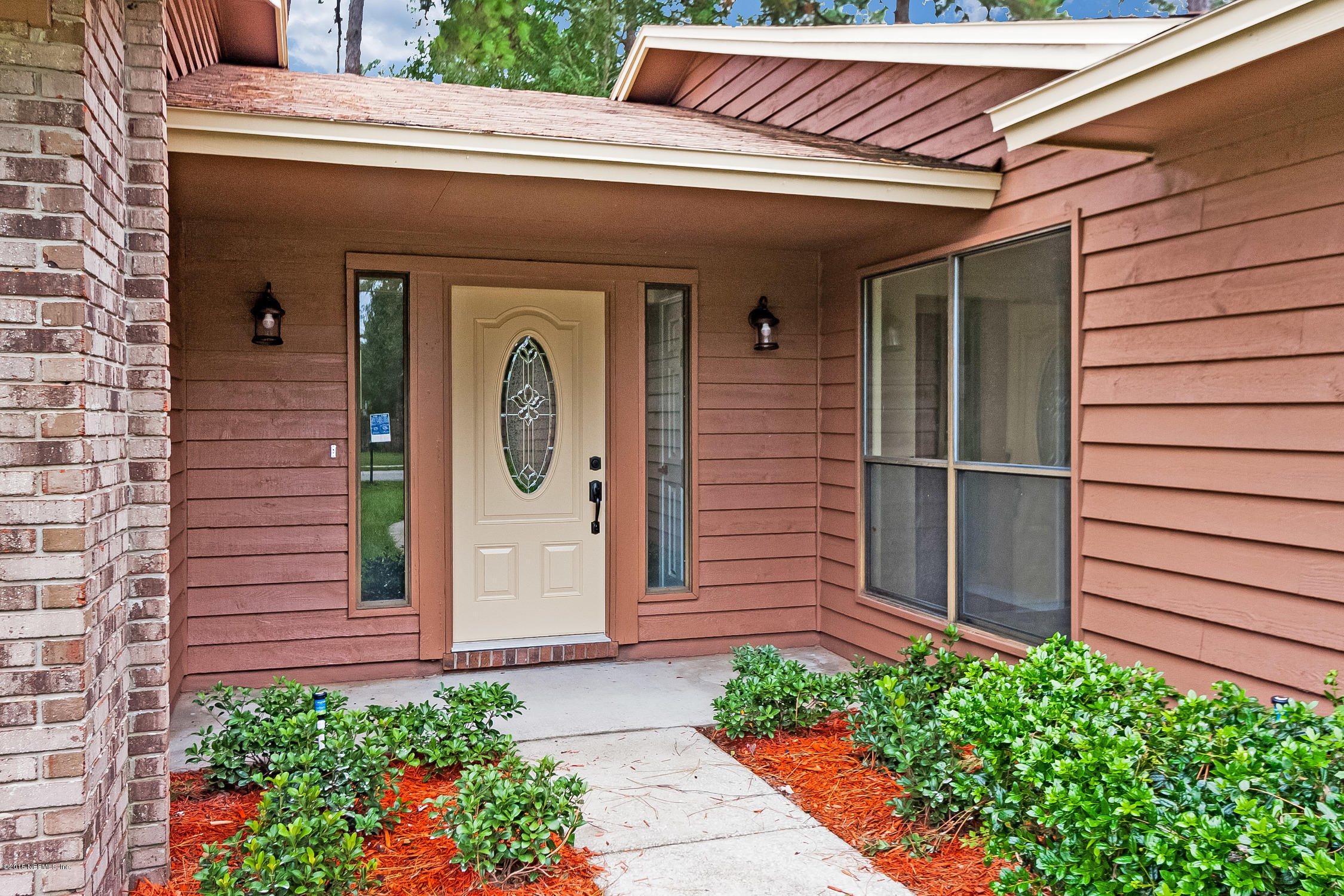 1551 Derringer Road Jacksonville, FL 32225 - Photo 4 of 27 a front view of a house with a garden