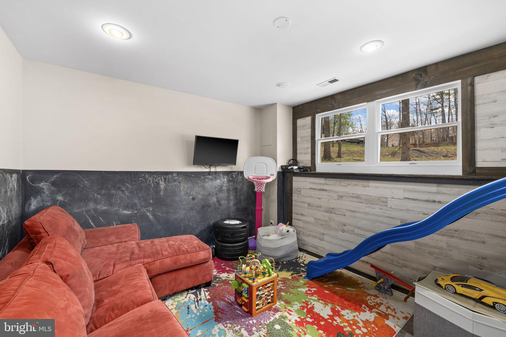 200 Wilderness Lane Locust Grove, VA 22508 - Photo 24 of 67 Vibrant playroom with natural light.