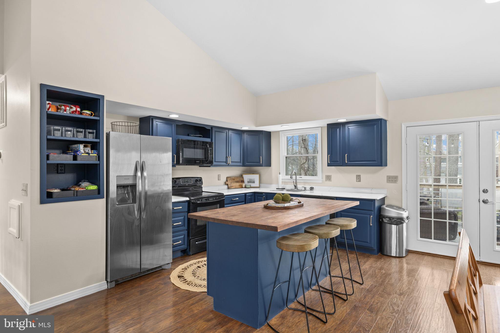 200 Wilderness Lane Locust Grove, VA 22508 - Photo 4 of 67 Modern kitchen with stylish blue accents.