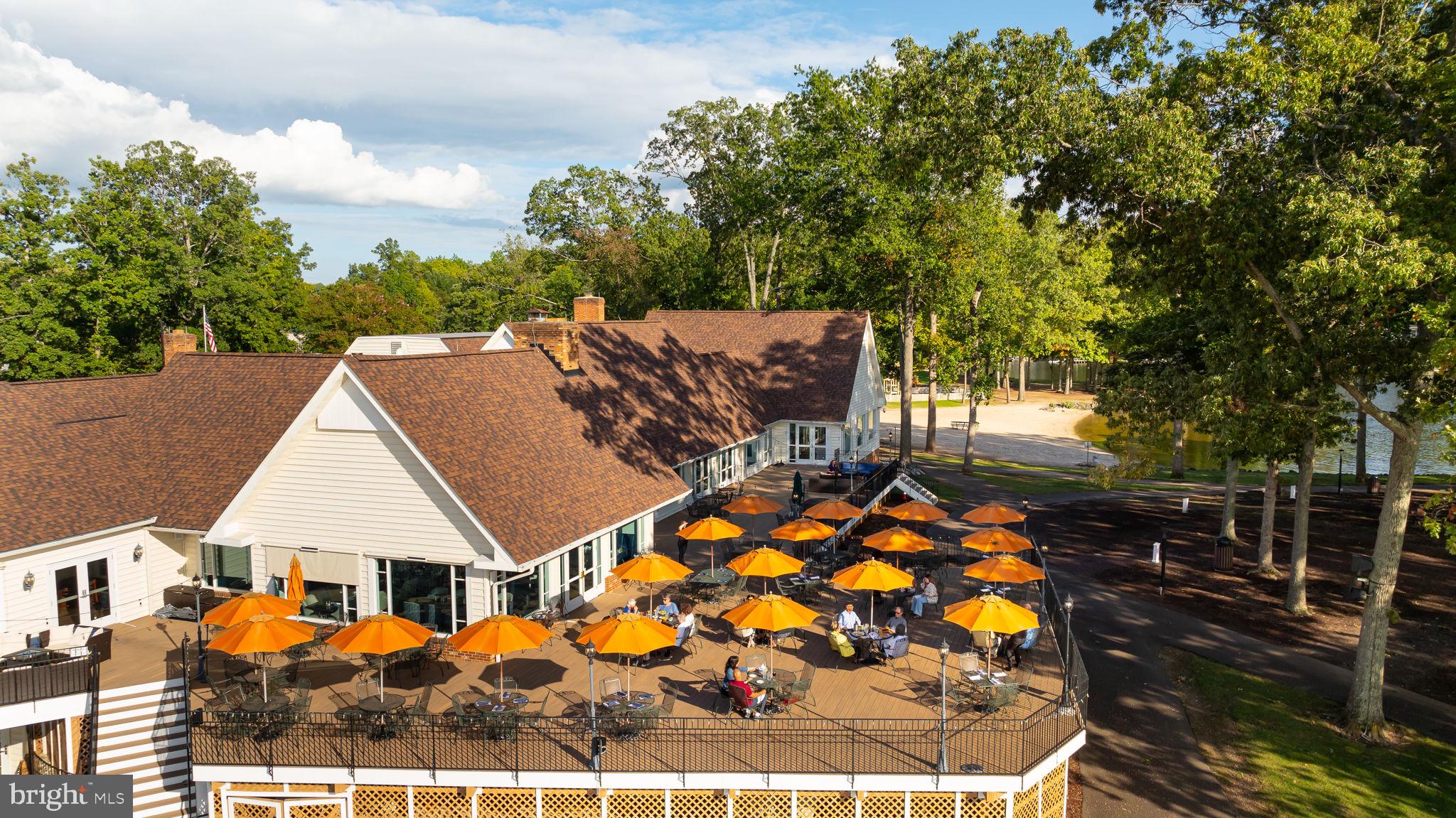 200 Wilderness Lane Locust Grove, VA 22508 - Photo 62 of 67 Sunny terrace with vibrant umbrellas.