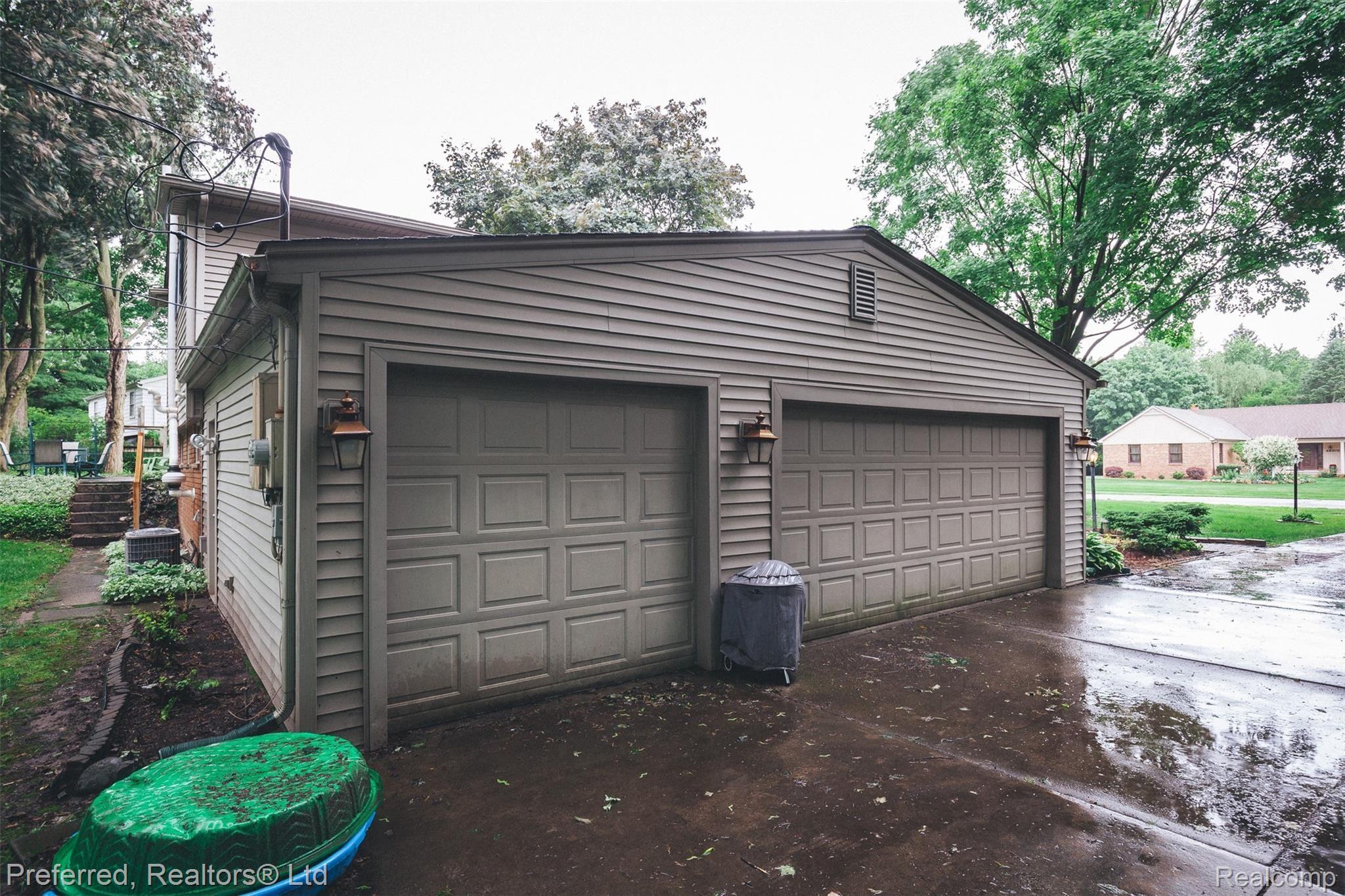 46959 Grasmere Road Northville, MI 48167 - Photo 18 of 19 OVERSIZED 3CAR GARAGE WITH EXTRA STORAGE SPACE