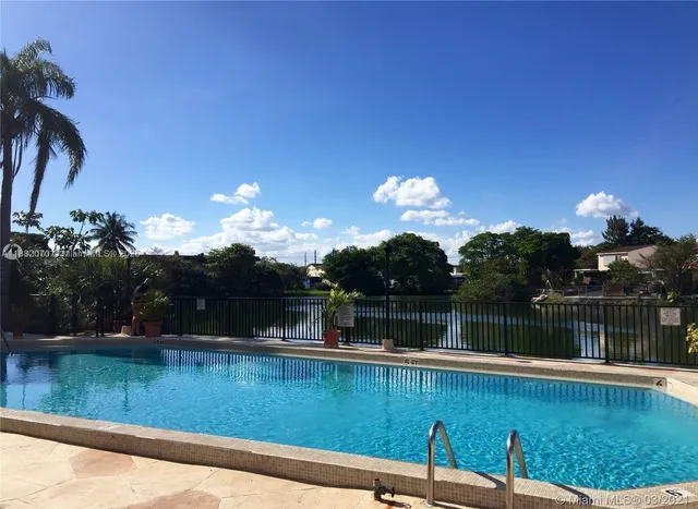 a view of a lake with a swimming pool
