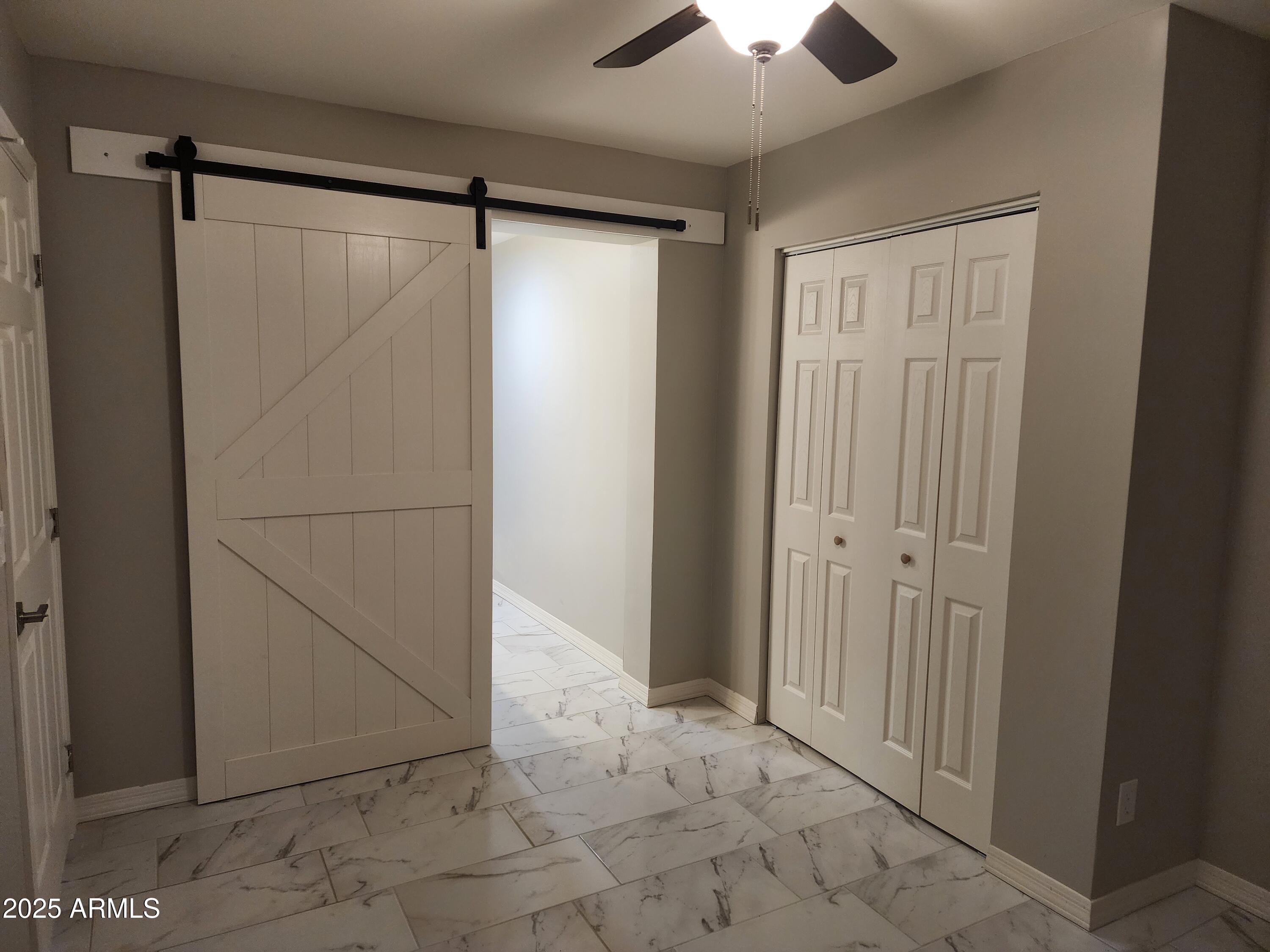 8838 North 2nd Way Phoenix, AZ 85020 - Photo 5 of 16 a view of an empty room with a bathroom