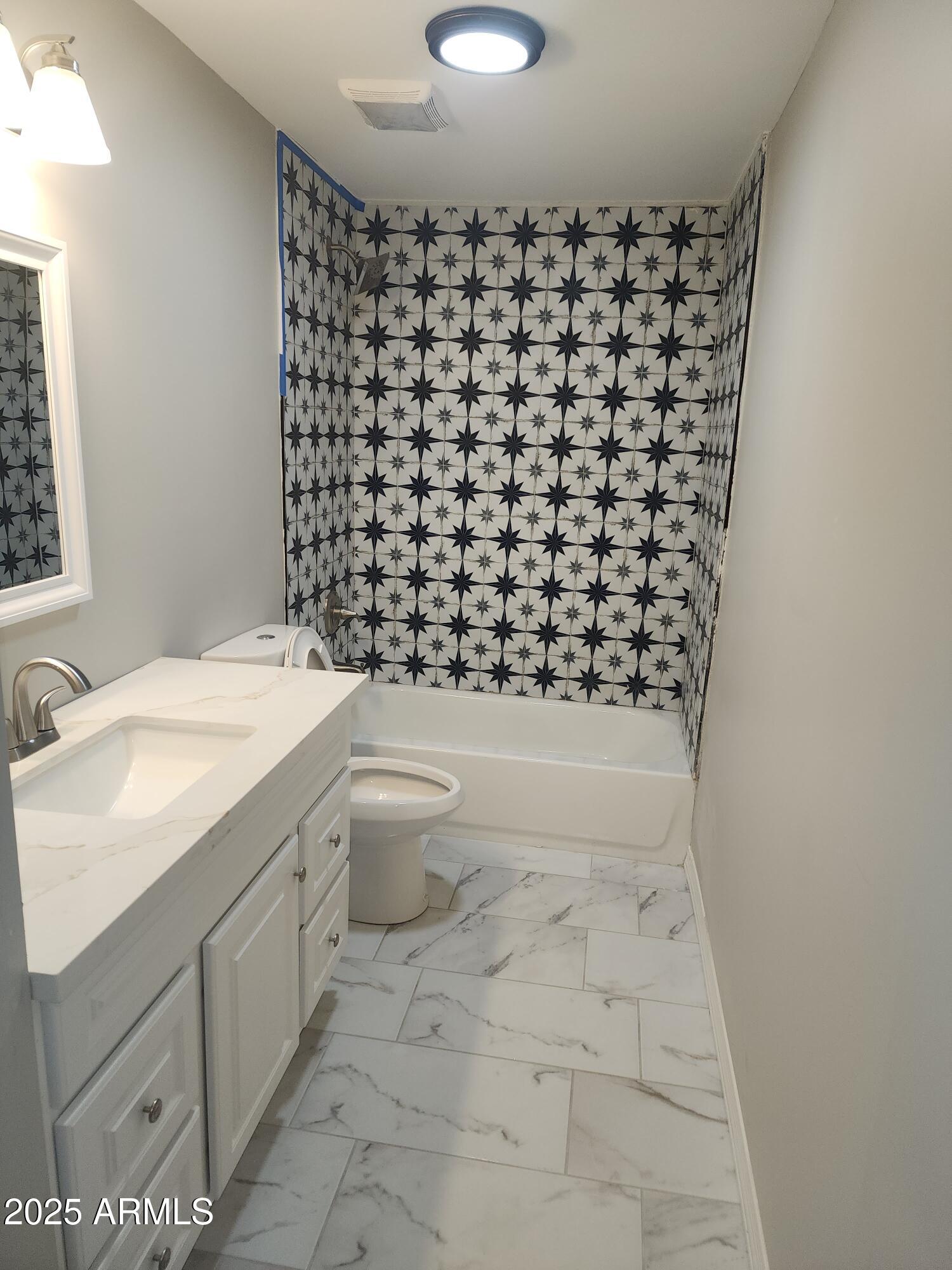 8838 North 2nd Way Phoenix, AZ 85020 - Photo 6 of 16 a bathroom with a sink toilet and shower