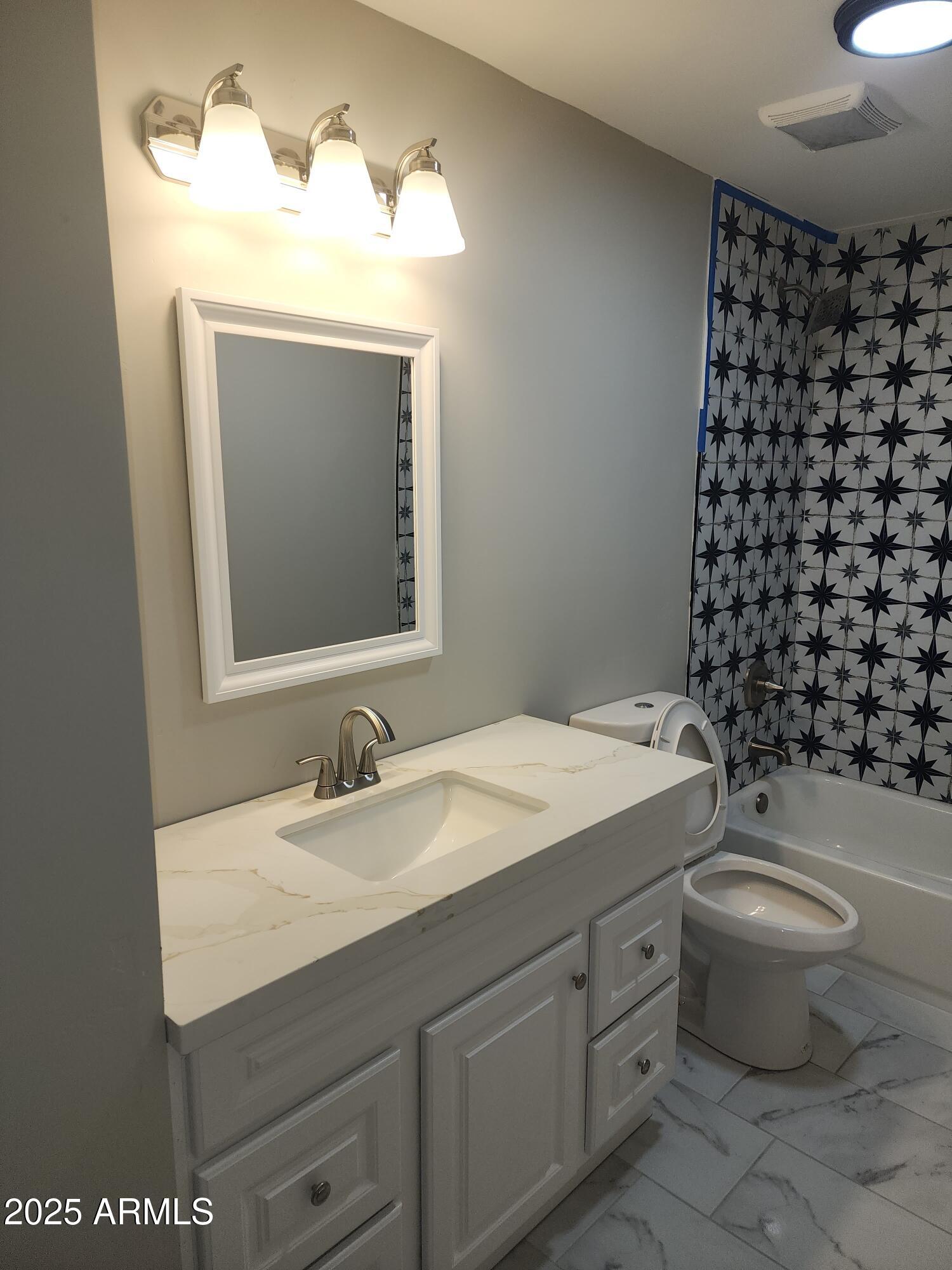 8838 North 2nd Way Phoenix, AZ 85020 - Photo 8 of 16 a bathroom with a sink toilet and mirror