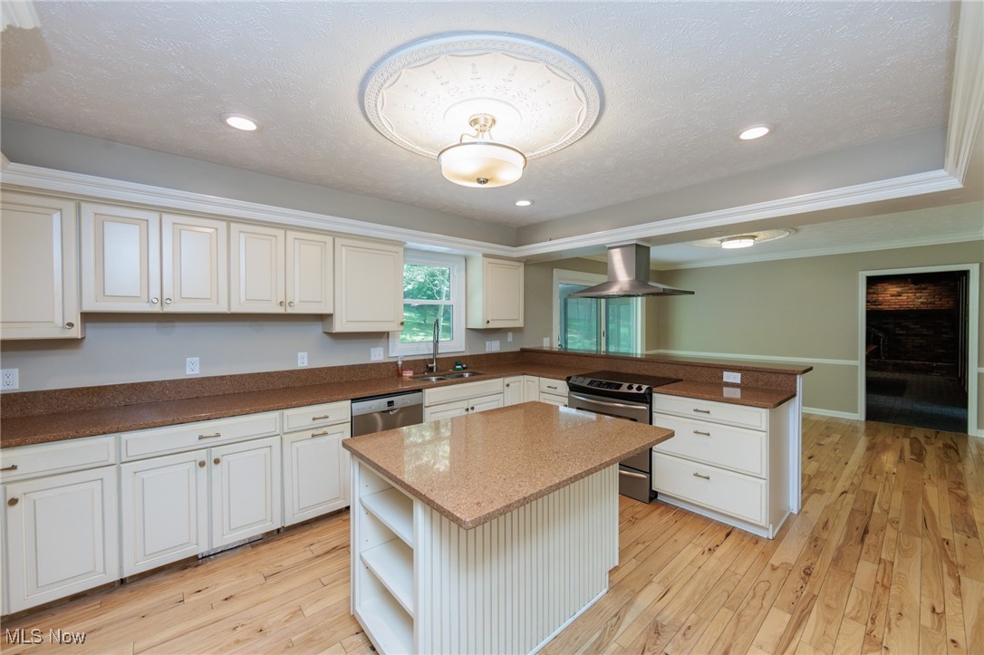 13655 Sperry Road Novelty, OH 44072 - Photo 5 of 32 Kitchen featuring open shelves, appliances with stainless steel finishes, light wood-style floors, dark stone countertops, and a peninsula