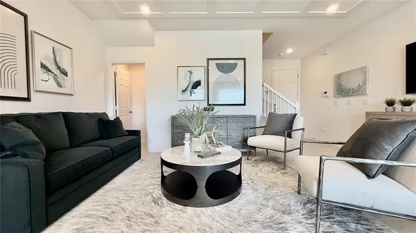 a view of a livingroom with furniture and a table