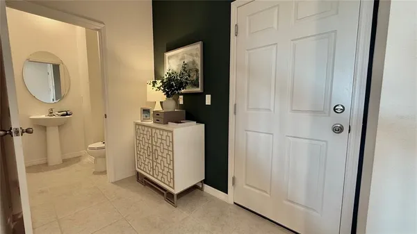 a room with a mirror and a toilet