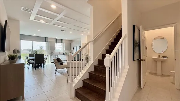 a view of entryway and hall with dining room