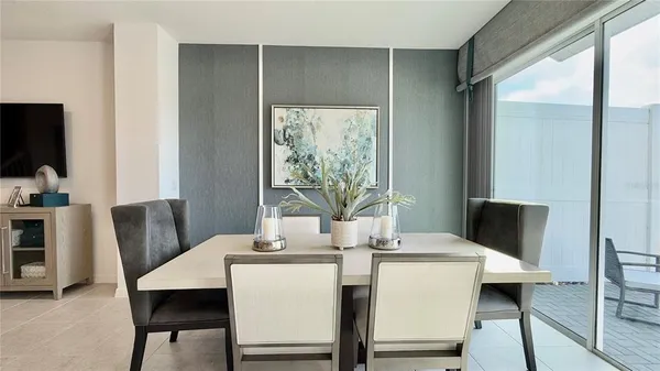 a dining room with furniture and wooden floor