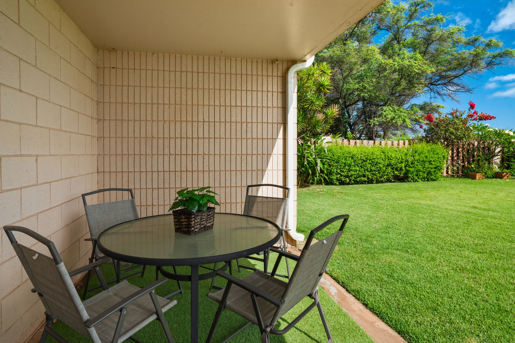 4451 Moana Road, Unit 309 Waimea, HI 96796 - Photo 21 of 21 a table and chairs in a garden