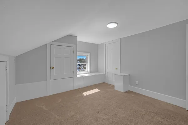 a view of entryway with wooden floor and stairs