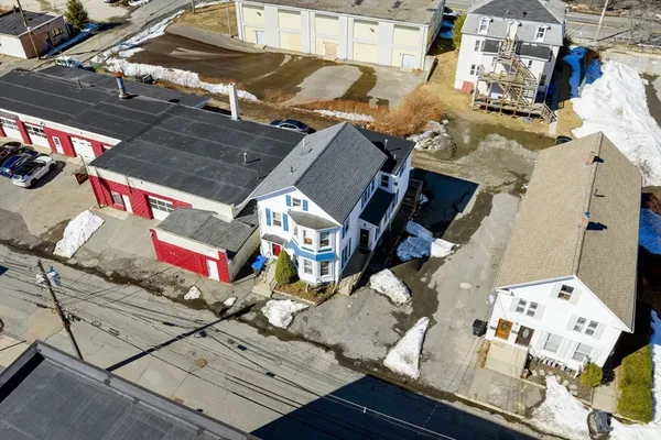 an aerial view of a house with a ocean view