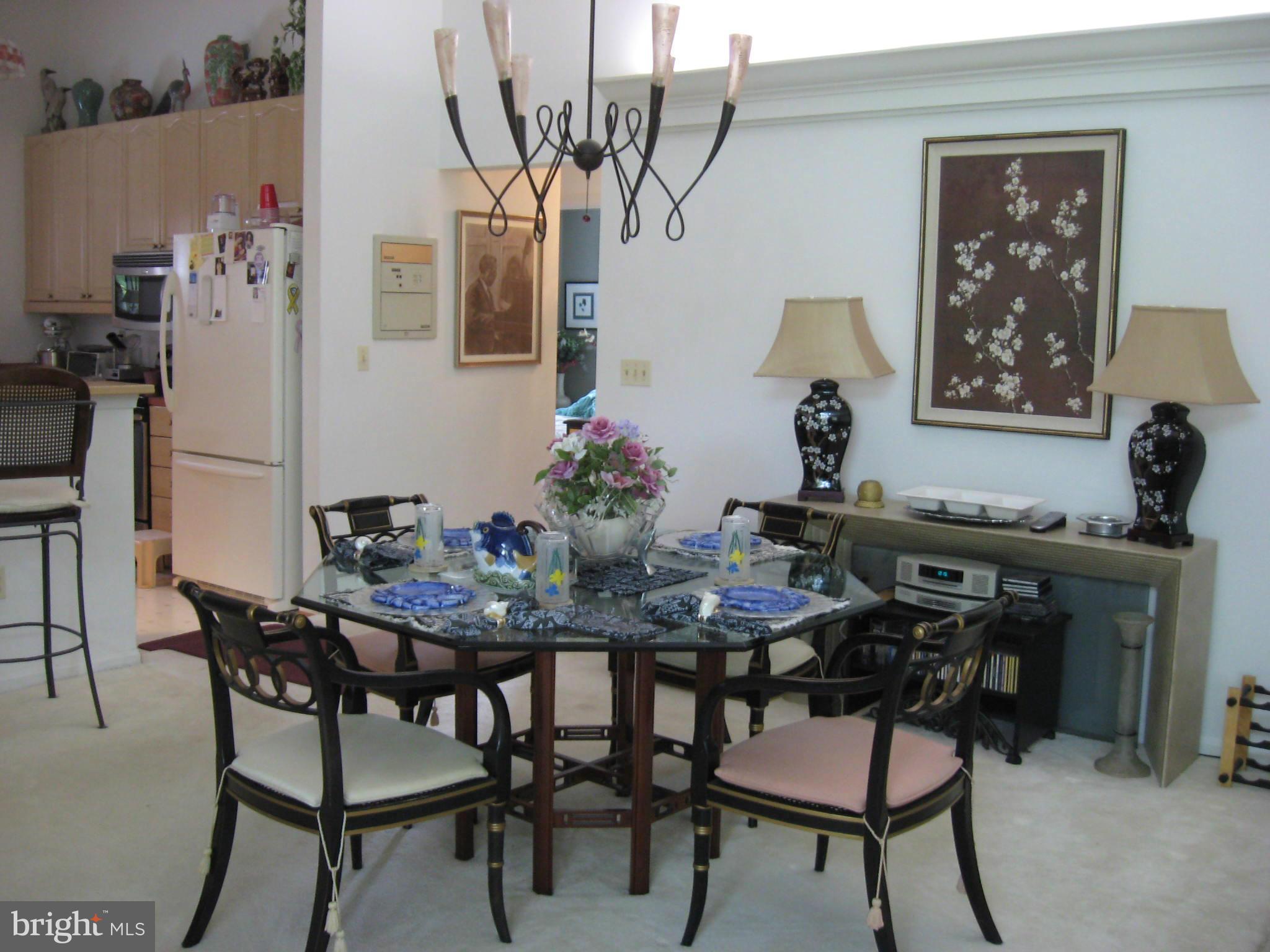 1236 Back Creek Loop, Unit 1236 Solomons, MD 20688 - Photo 4 of 24 a dining room with furniture and window
