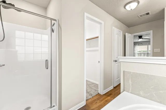 a view of a bathroom with a sink and a mirror