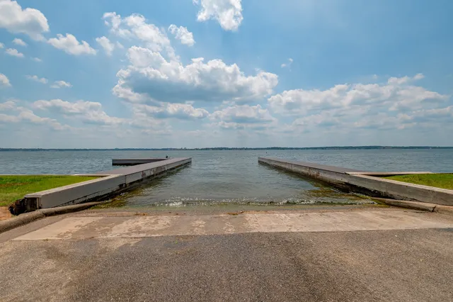 a view of swimming pool with seating area and barbeque grill