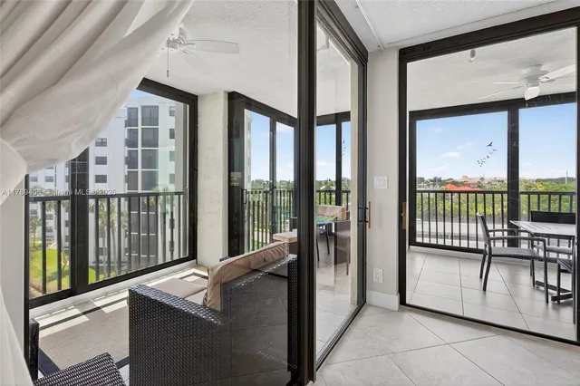 a view of a living room and balcony