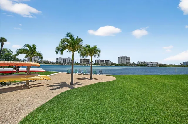 a view of a swimming pool with a table and chairs