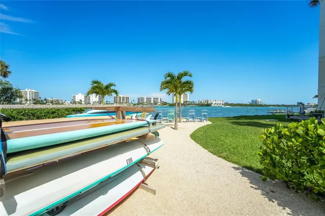a view of a swimming pool with a yard