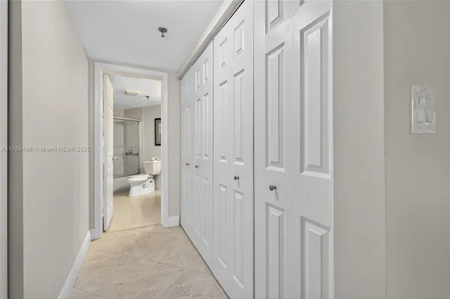 a bathroom with a glass shower door