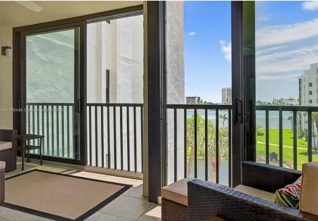 a view of a balcony with floor to ceiling window wooden floor and floor