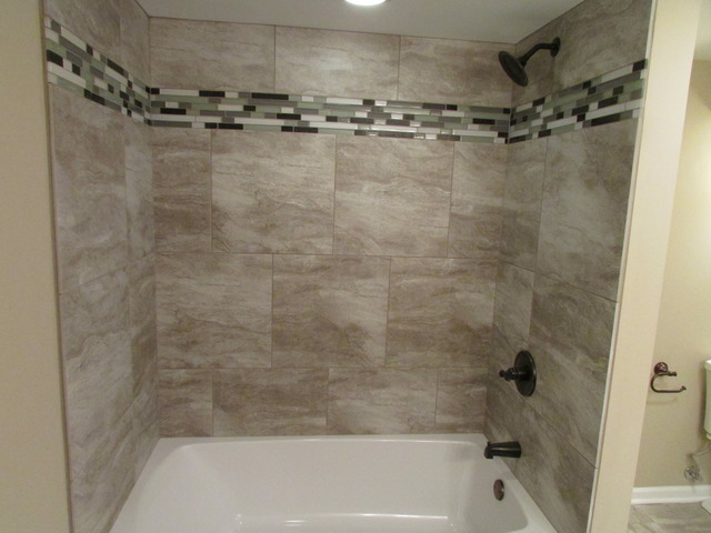 7719 East Prairie Road Skokie, IL 60076 - Photo 12 of 25 a bathroom with a shower and a bath tub