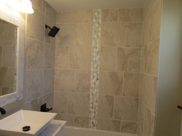 7719 East Prairie Road Skokie, IL 60076 - Photo 14 of 25 a bathroom with a shower and a sink