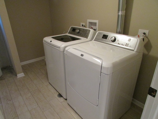 7719 East Prairie Road Skokie, IL 60076 - Photo 16 of 25 a utility room with dryer and washer