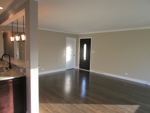 7719 East Prairie Road Skokie, IL 60076 - Photo 17 of 25 a view of an empty room with window and wooden floor