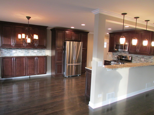 7719 East Prairie Road Skokie, IL 60076 - Photo 2 of 25 a view of a kitchen with a sink and a wooden floor