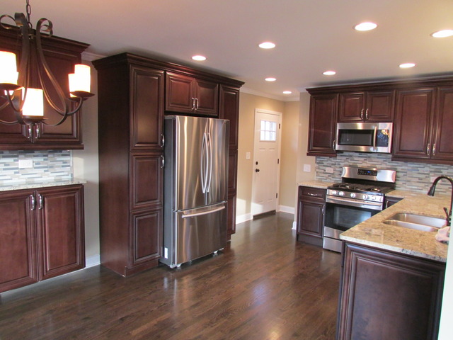 7719 East Prairie Road Skokie, IL 60076 - Photo 4 of 25 a kitchen with stainless steel appliances granite countertop a refrigerator stove and oven