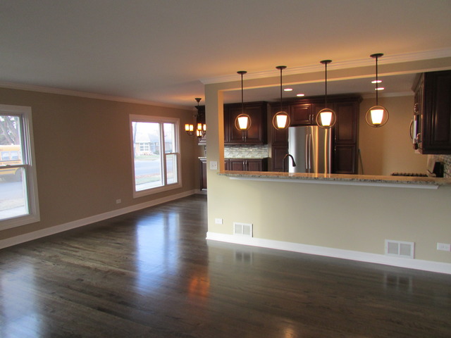7719 East Prairie Road Skokie, IL 60076 - Photo 5 of 25 an empty room with wooden floor and windows