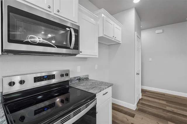 a kitchen with a stove and a microwave