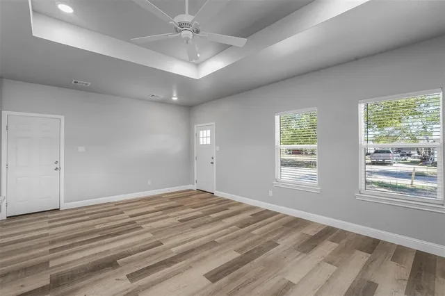 a view of an empty room with a window