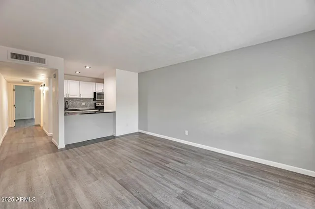 a view of kitchen with wooden floor