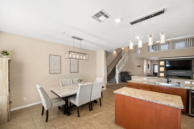 a view of a livingroom with furniture and a flat screen tv