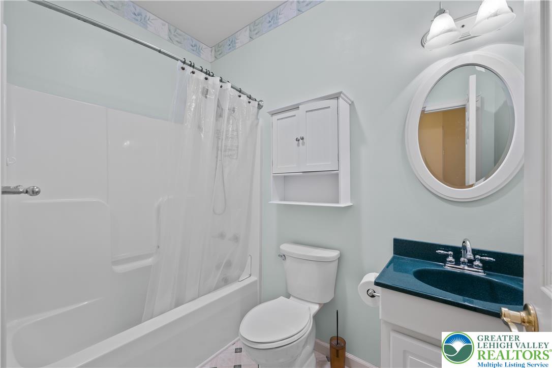 1 Pinewood Circle Hazleton, PA 18202 - Photo 24 of 33 a bathroom with a sink a toilet and a mirror