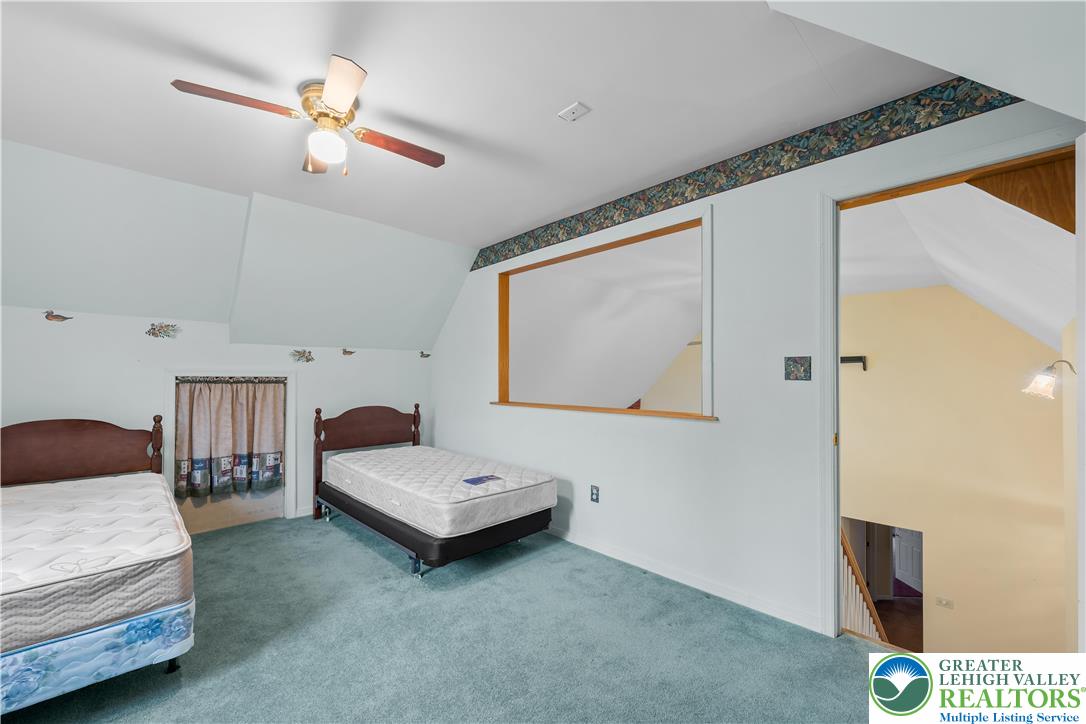 1 Pinewood Circle Hazleton, PA 18202 - Photo 28 of 33 a bedroom with a bed and a chandelier